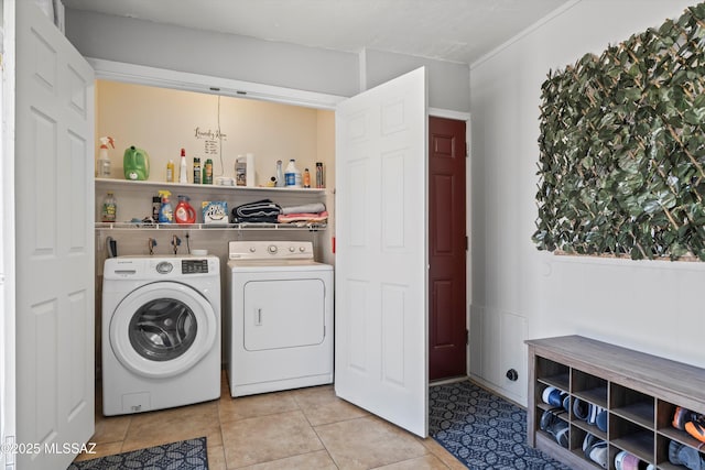9061 E 39th St, Tucson, AZ 85730 - washroom with light tile patterned floors, laundry area, and washer and clothes dryer