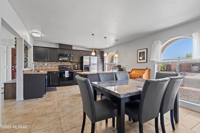 9061 E 39th St, Tucson, AZ 85730 - dining area featuring a healthy amount of sunlight and light tile patterned floors