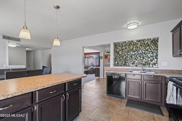 9061 E 39th St, Tucson, AZ 85730 - kitchen featuring visible vents, dark brown cabinetry, light countertops, a sink, and black appliances