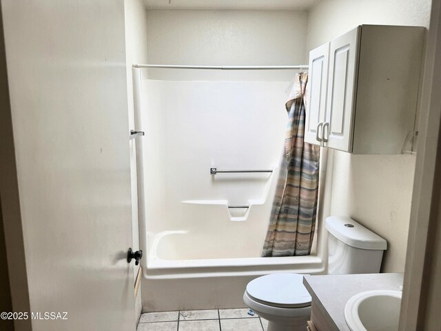 full bathroom featuring shower / bath combo with shower curtain, tile patterned flooring, vanity, and toilet
