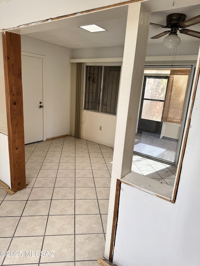 interior space featuring a ceiling fan