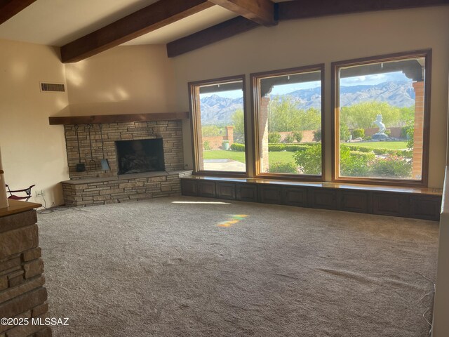 942 N Rancho Del Jefe Loop, Tucson, AZ 85748 - unfurnished living room with a stone fireplace and carpet floors
