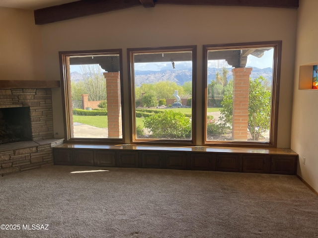 942 N Rancho Del Jefe Loop, Tucson, AZ 85748 - unfurnished living room with carpet flooring, plenty of natural light, and a stone fireplace