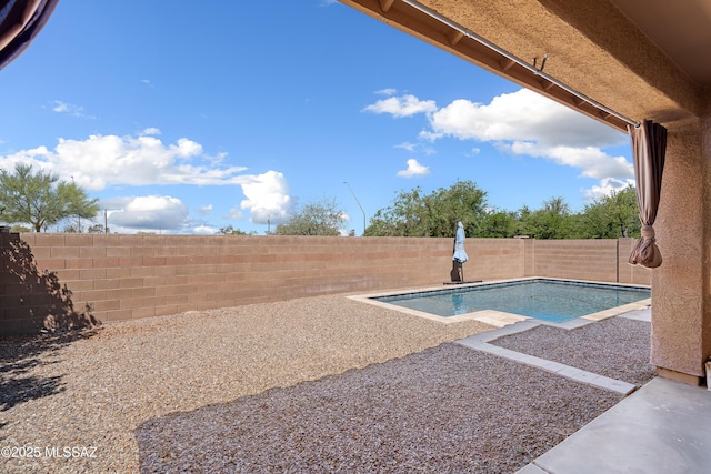 view of pool with a fenced in pool, a patio area, and a fenced backyard