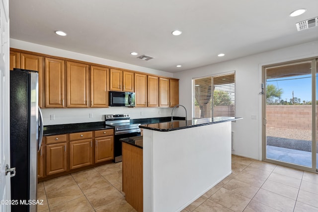 kitchen featuring stainless steel appliances, visible vents, and recessed lighting
