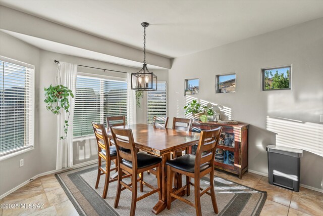 9224 S Big Tree Ln, Tucson, AZ 85756 - dining space featuring baseboards and an inviting chandelier