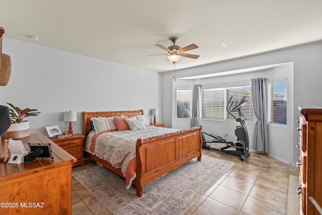 9224 S Big Tree Ln, Tucson, AZ 85756 - bedroom with ceiling fan and light tile patterned floors