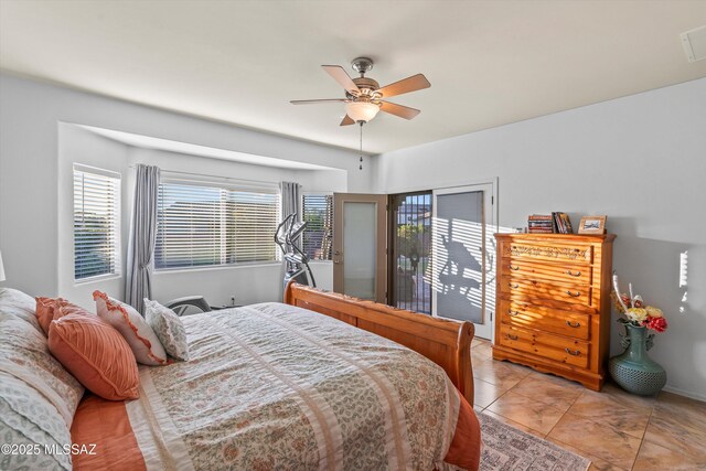 9224 S Big Tree Ln, Tucson, AZ 85756 - bedroom featuring a ceiling fan and multiple windows