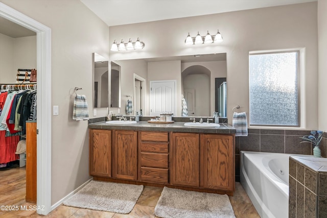 9224 S Big Tree Ln, Tucson, AZ 85756 - bathroom with a bath, a sink, and double vanity