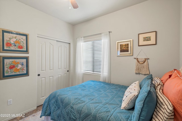 9224 S Big Tree Ln, Tucson, AZ 85756 - bedroom with a closet, baseboards, and ceiling fan