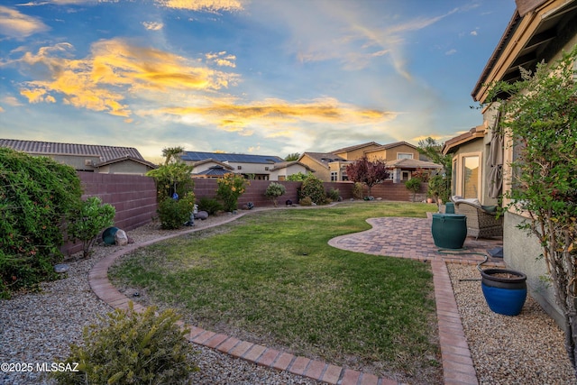 9224 S Big Tree Ln, Tucson, AZ 85756 - yard at dusk with a fenced backyard and a patio