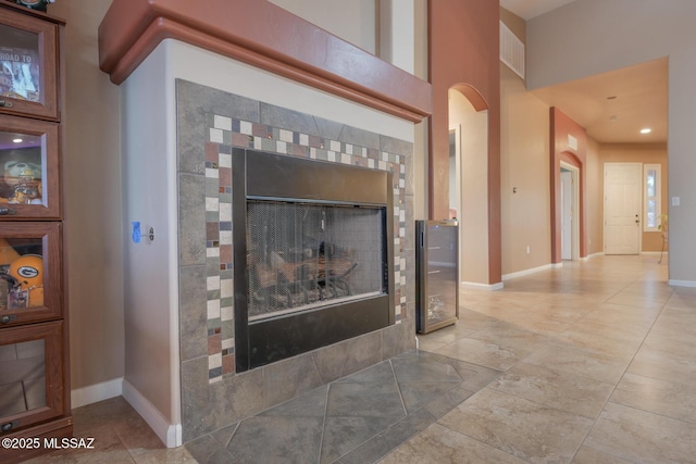 14245 E Wild Jesse Way, Vail, AZ 85641 - detailed view of arched walkways, baseboards, and a fireplace