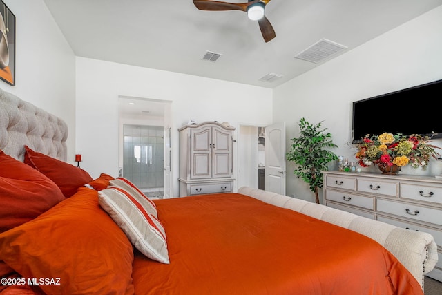 bedroom with ceiling fan, visible vents, and ensuite bathroom