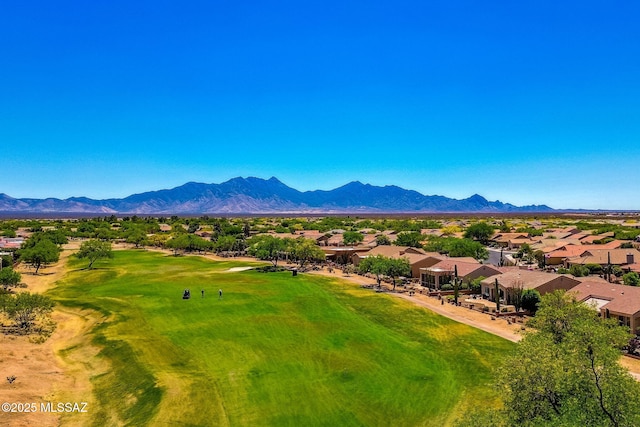 drone / aerial view with a residential view, view of golf course, and a mountain view