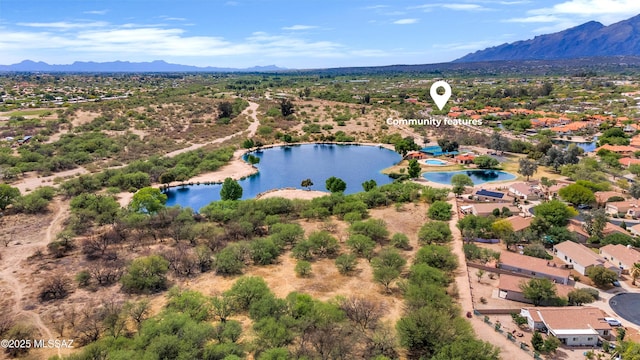 bird's eye view with a water and mountain view