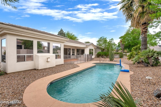 outdoor pool with a patio area