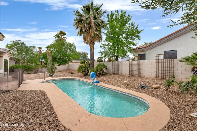 view of pool featuring a fenced in pool and a fenced backyard