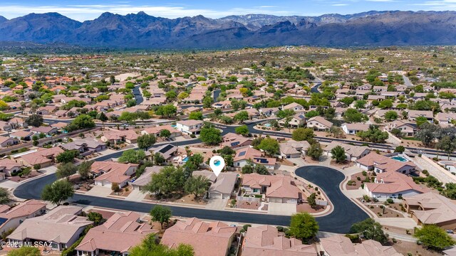birds eye view of property with a residential view and a mountain view