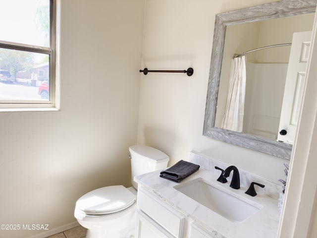 bathroom with toilet, curtained shower, and vanity