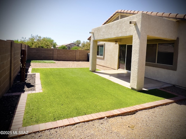 view of yard featuring a patio and a fenced backyard