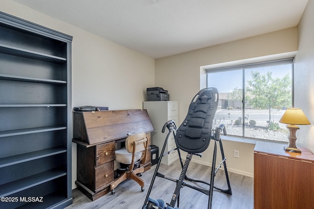 office area featuring baseboards and wood finished floors