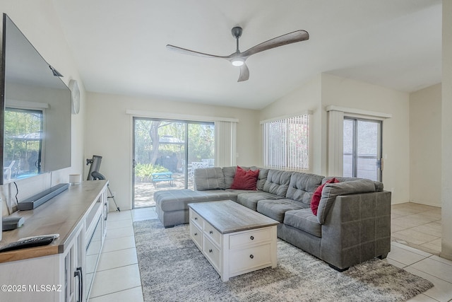 living area featuring ceiling fan, a wealth of natural light, and light tile patterned floors