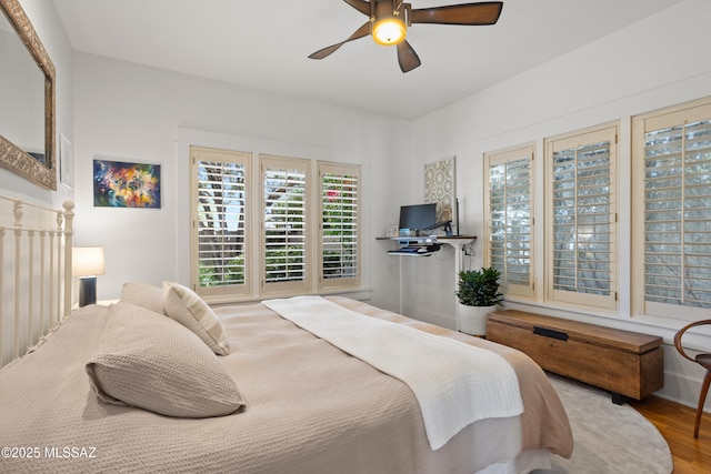 bedroom featuring ceiling fan and wood finished floors