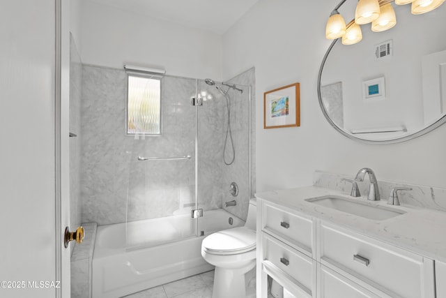 bathroom featuring vanity, washtub / shower combination, toilet, and visible vents