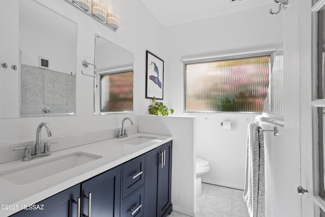 full bath with visible vents, a wealth of natural light, and a sink