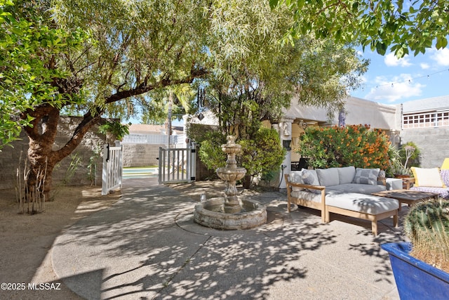 view of patio featuring fence and outdoor lounge area