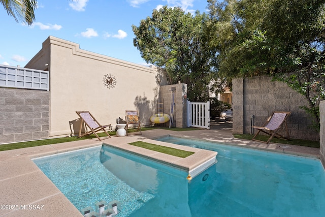 view of swimming pool with fence and a fenced in pool