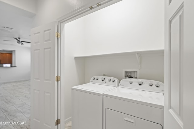 laundry area with laundry area, marble finish floor, washing machine and dryer, visible vents, and a ceiling fan