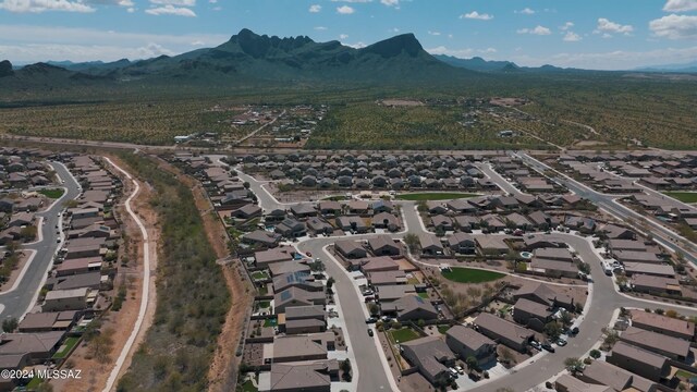 birds eye view of property with a mountain view and a residential view
