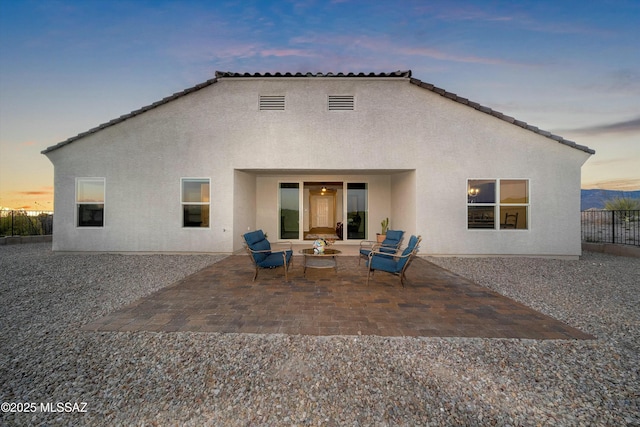 14633 E Old Owl Creek Ct, Vail, AZ 85641 - back of house featuring stucco siding, a patio area, and an outdoor living space