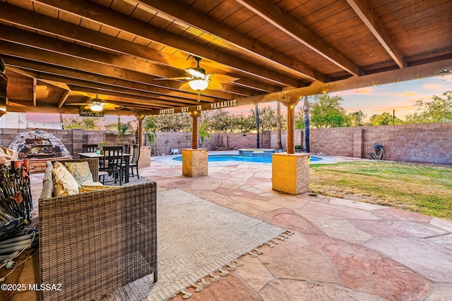 view of patio with a fenced in pool, a fenced backyard, a ceiling fan, and outdoor dining area