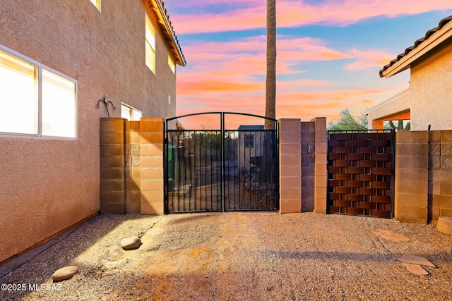 gate at dusk with fence