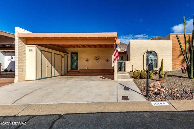 manufactured / mobile home with entry steps and an attached carport