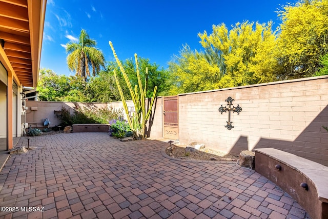 view of patio with a gate and a fenced backyard
