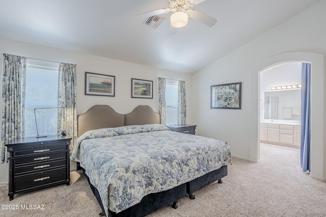 bedroom with visible vents, baseboards, ceiling fan, light colored carpet, and vaulted ceiling