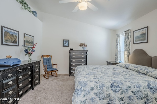 bedroom featuring ceiling fan, vaulted ceiling, and light colored carpet