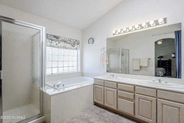 bathroom with a sink, a stall shower, a garden tub, and connected bathroom