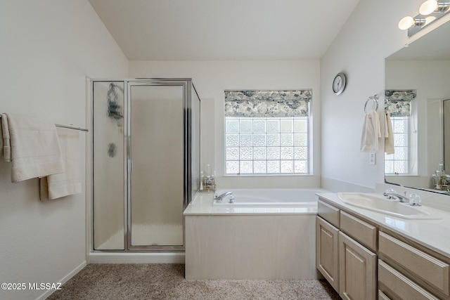 full bath featuring vanity, a garden tub, and a shower stall
