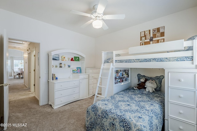 bedroom featuring a ceiling fan and light colored carpet