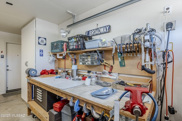 garage with a workshop area
