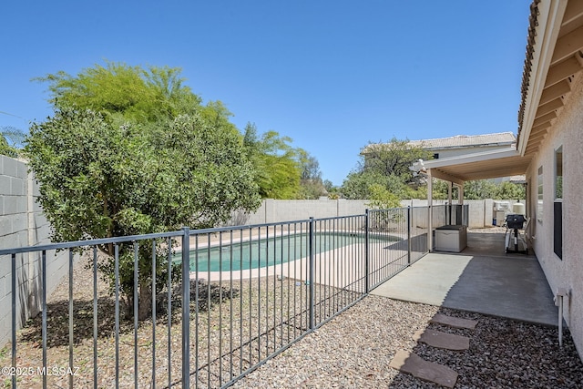 view of pool with a fenced backyard, a fenced in pool, and a patio area
