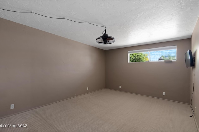 3202 W Calle Cereza, Tucson, AZ 85741 - empty room featuring a textured ceiling, light carpet, and baseboards