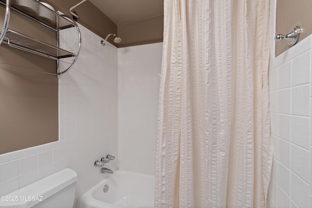 3202 W Calle Cereza, Tucson, AZ 85741 - bathroom with toilet, shower / bath combination with curtain, and tile walls