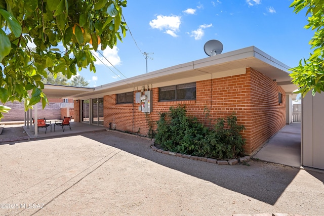 3202 W Calle Cereza, Tucson, AZ 85741 - rear view of property with brick siding and a patio area