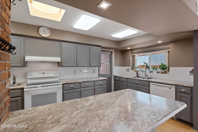 3202 W Calle Cereza, Tucson, AZ 85741 - kitchen featuring gray cabinetry, white appliances, under cabinet range hood, and a sink