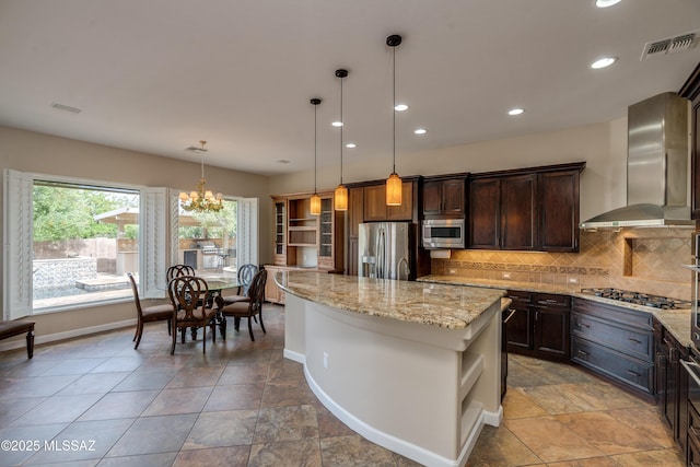 36330 S Desert Sun Dr, Tucson, AZ 85739 - kitchen with stainless steel appliances, open shelves, wall chimney exhaust hood, dark brown cabinets, and recessed lighting